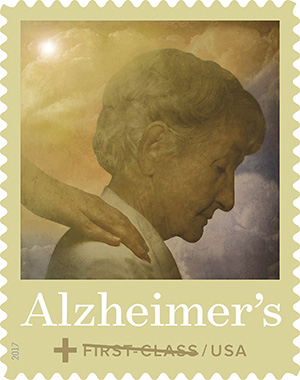 Alzheimer's first class stamp; older woman, with someone's hand on her shoulder.