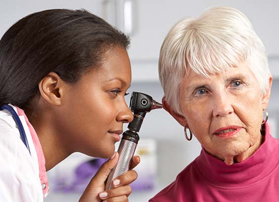 Doctor checking a patient's ears